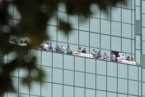 Fans Watch From a High Rise Balcony