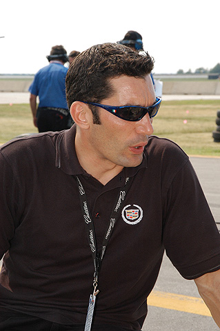 Max Papis Sitting On Pit Wall