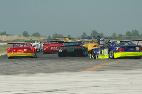 Rear View of Start of Trans-Am Race in First Turn