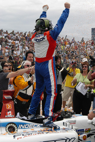 Paul Tracy Stands On His Car