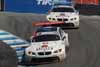 Two BMW M3 GT Driven by Bill Auberlen and Tommy Milner leading Dirk Müller and Joey Hand Thumbnail