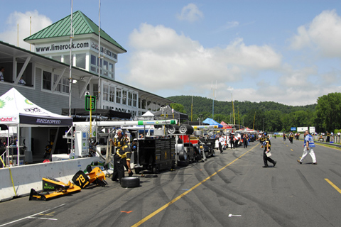 View of Pitlane, Building, and Crew Set Ups