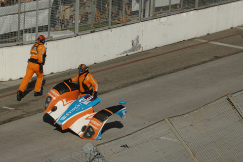 Safety Workers Picking Up Nosepiece of LMPC Oreca FLM09