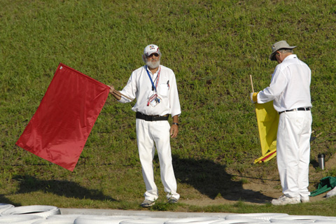 Corner Worker Displaying Red Flag
