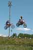 Two Motocrossers Flying High Thumbnail