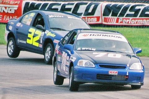 Two SSC Cars Lifting Wheels
