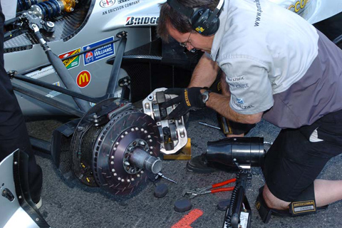 Crew Working on Mario Dominguez's Brakes
