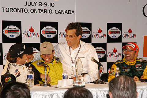 Carl Russo Sitting on Justin Wilson's Lap During Press Conference