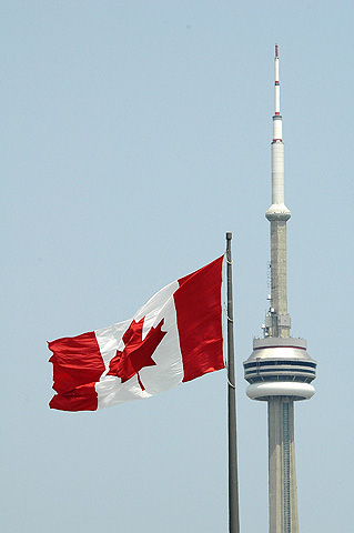 Canadian Flag Next to CN Tower